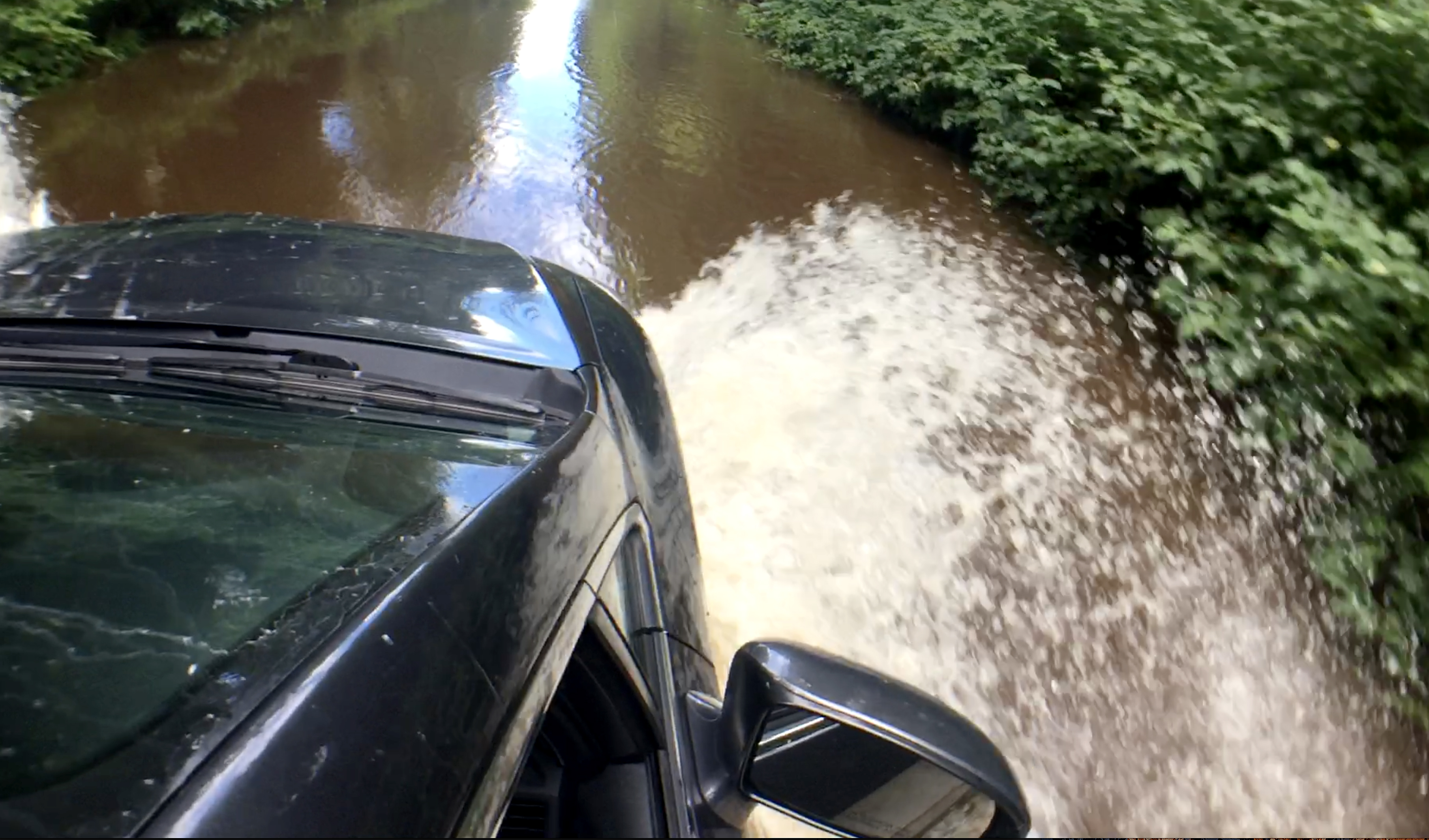 car in flooded road